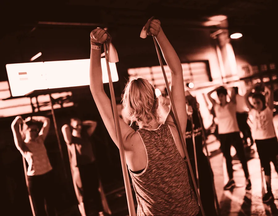 A group training class mid-session, the energy the Forge Fitness pop-up was built to capture