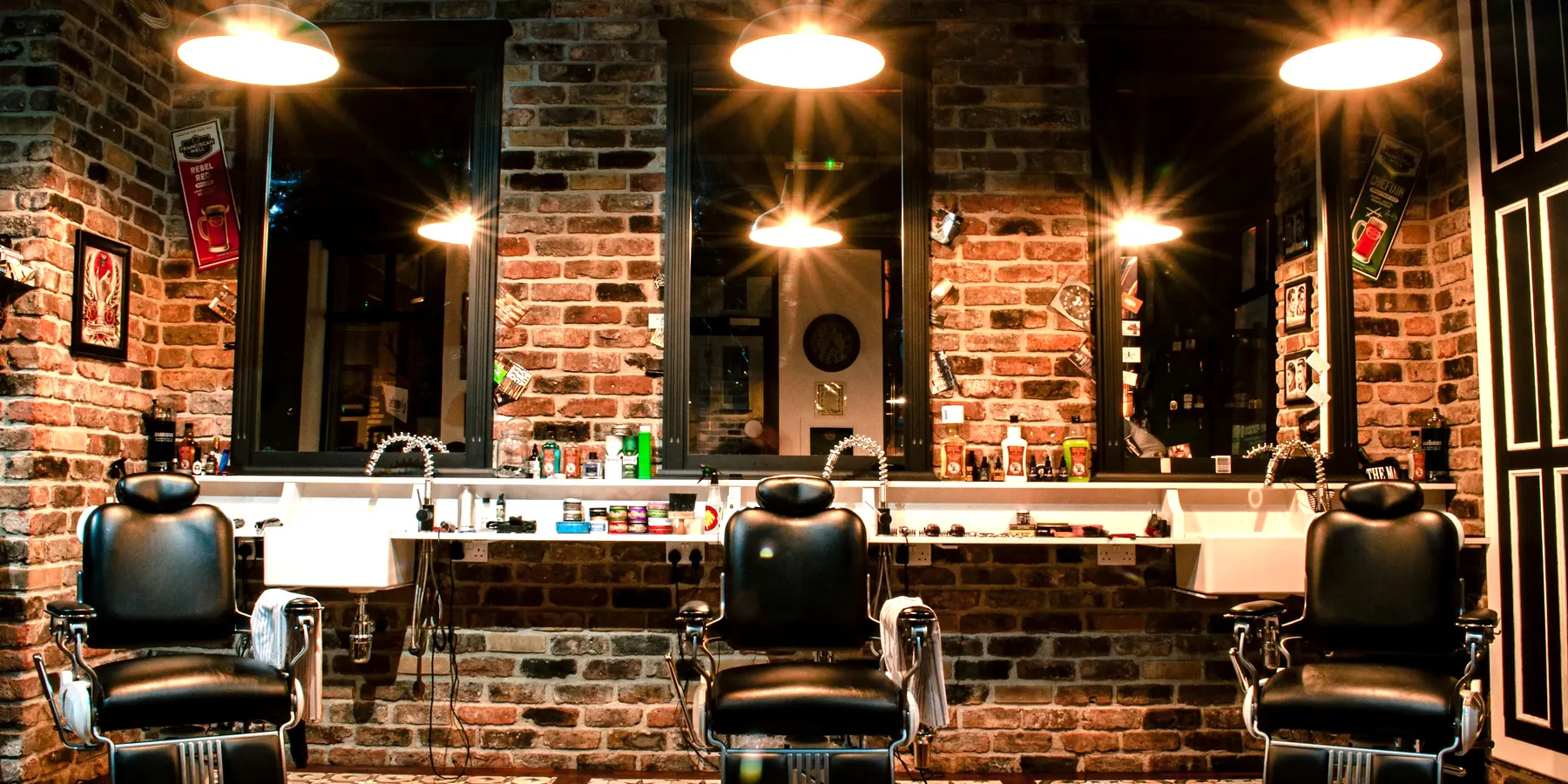 The Quarter shop floor, brick walls and barber chairs in a row