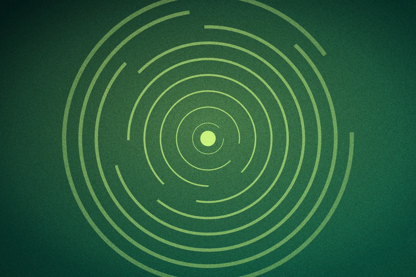 Broken lime rings spiralling out from a solid core on deep green.