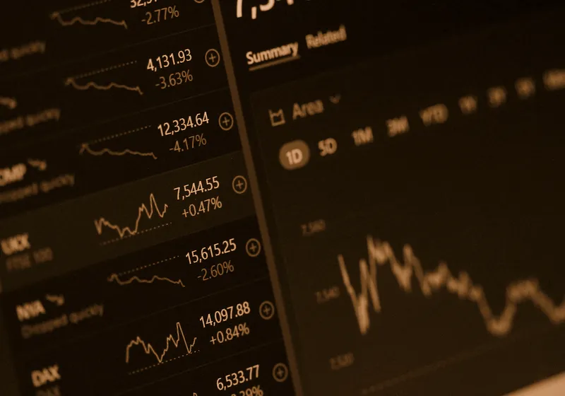 A trading terminal showing index rows and an area chart.
