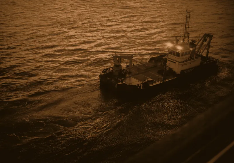 A survey vessel working offshore in open water.