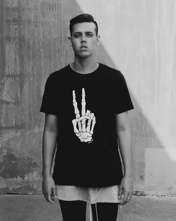 Stencil print tee worn over a longline layer