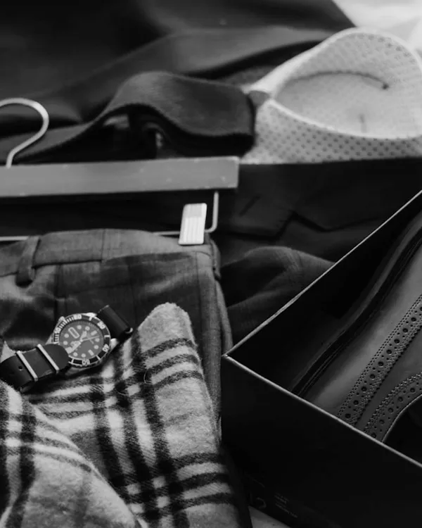 Flat lay of folded work trousers and accessories