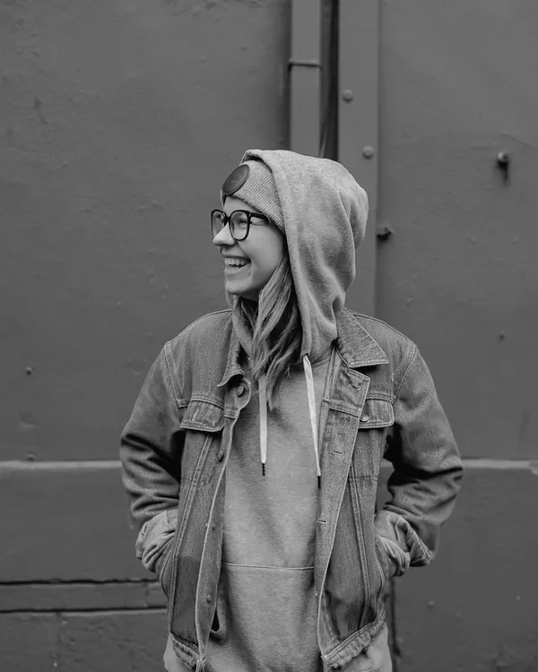 Model in a heavyweight zip hood under a denim layer