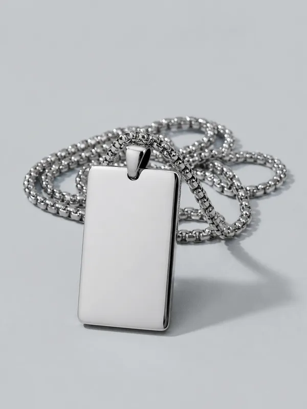 A plain engraved platinum tag hanging from a fine chain.