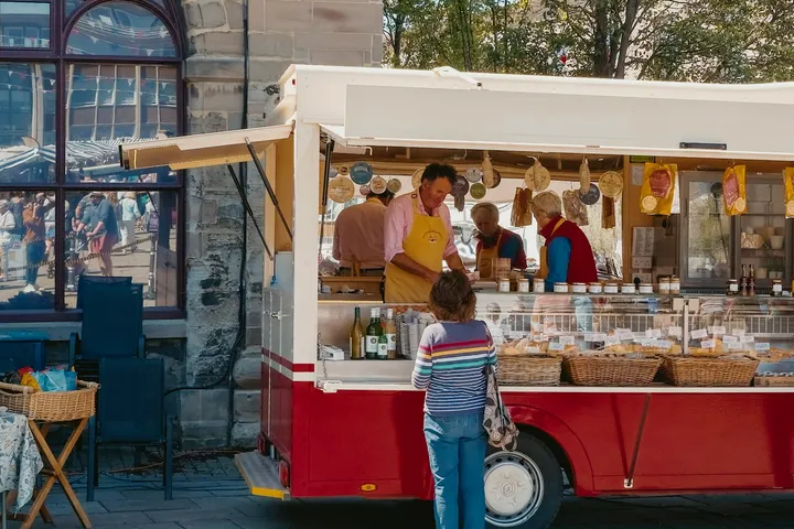 A trader serving from a trailer in the Saturday sunshine