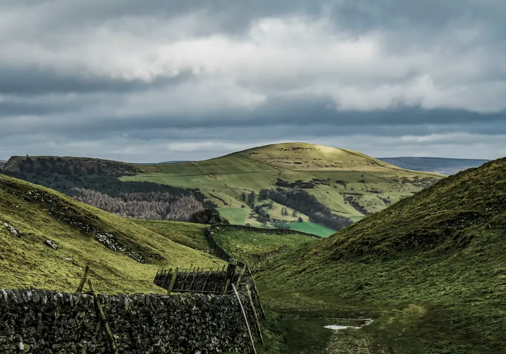 The hills above the cabin, dry stone wall running down towards the valley floor