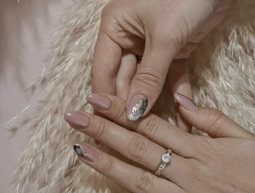 A finished set of nails with hand-painted detail