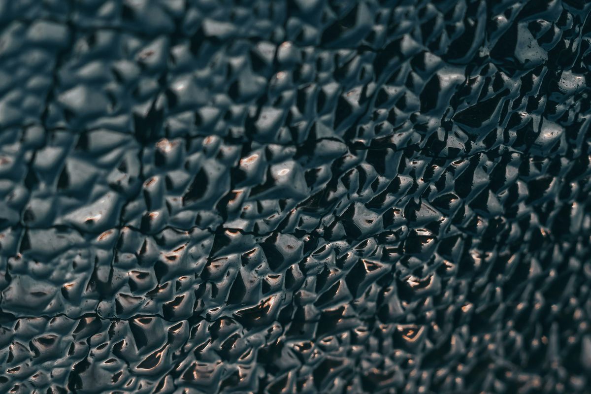 Dark rippled geological surface