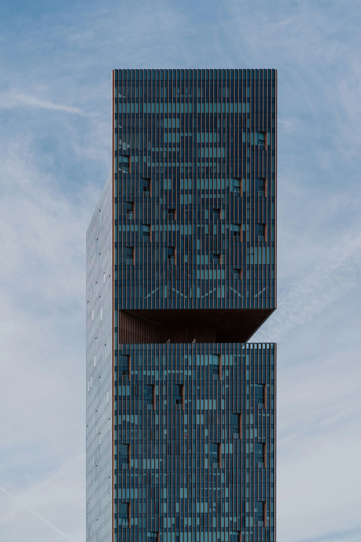 Modern tower rising into a pale sky