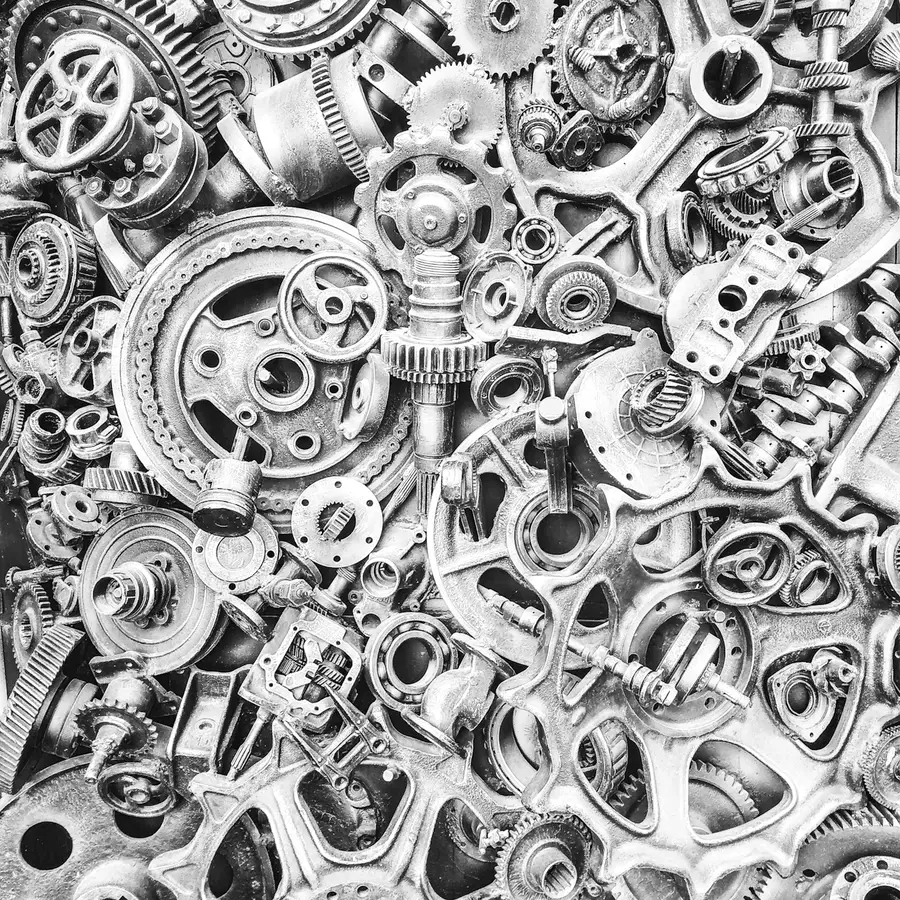 A dense wall of gears, bearings and machined components packed edge to edge.