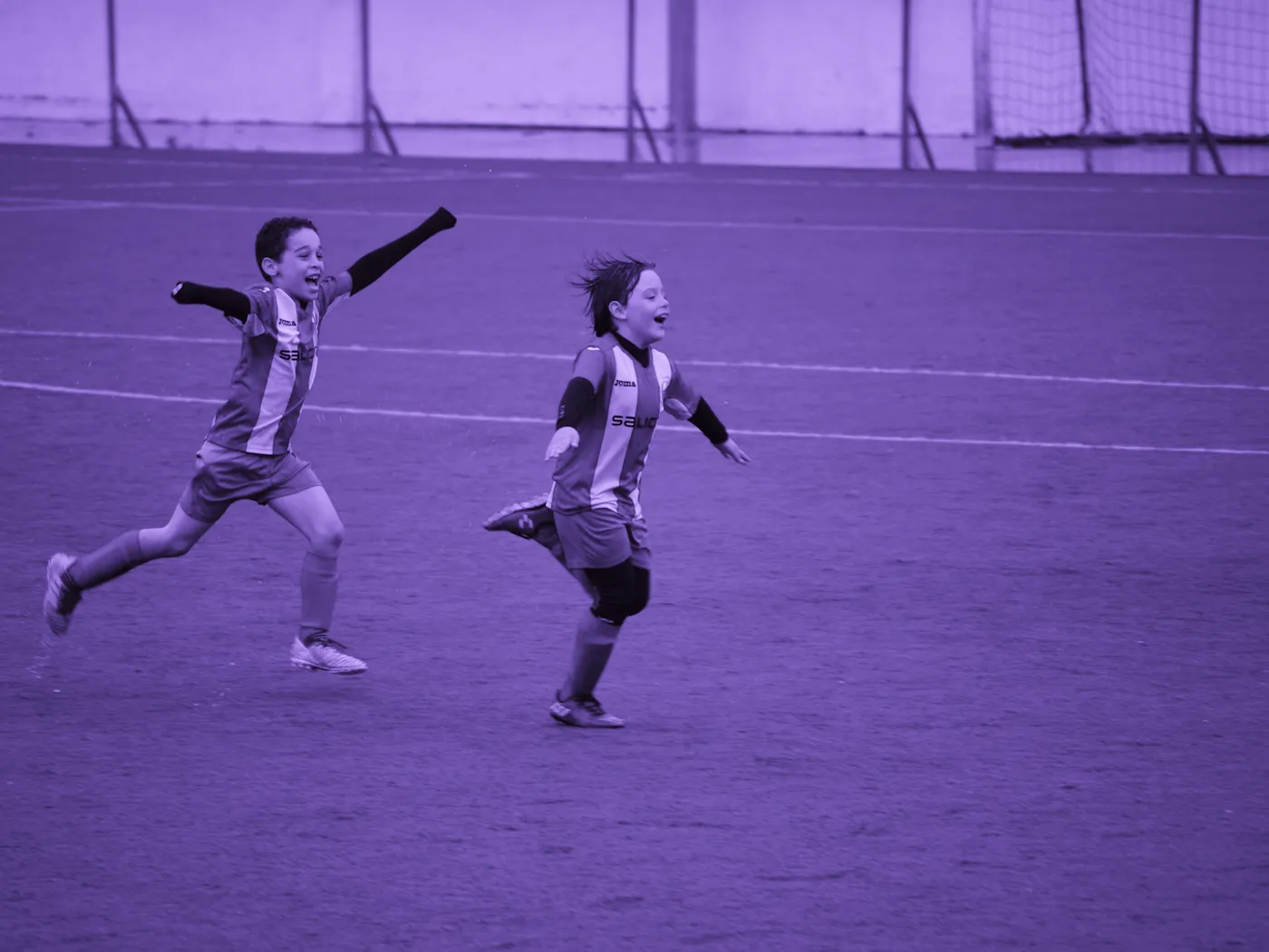 Two academy players chasing a ball at the Brickfield Lane pitches