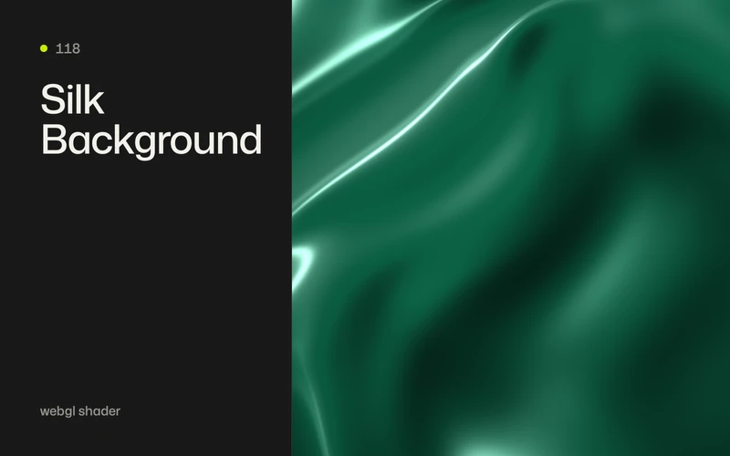 Deep emerald satin folds with long pale highlights across a full-frame background